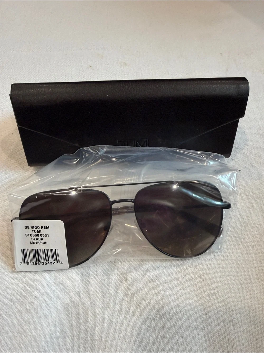 Tumi Black Aviator Sunglasses with Dark Lenses and Case